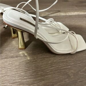 White strap heels with gold heel